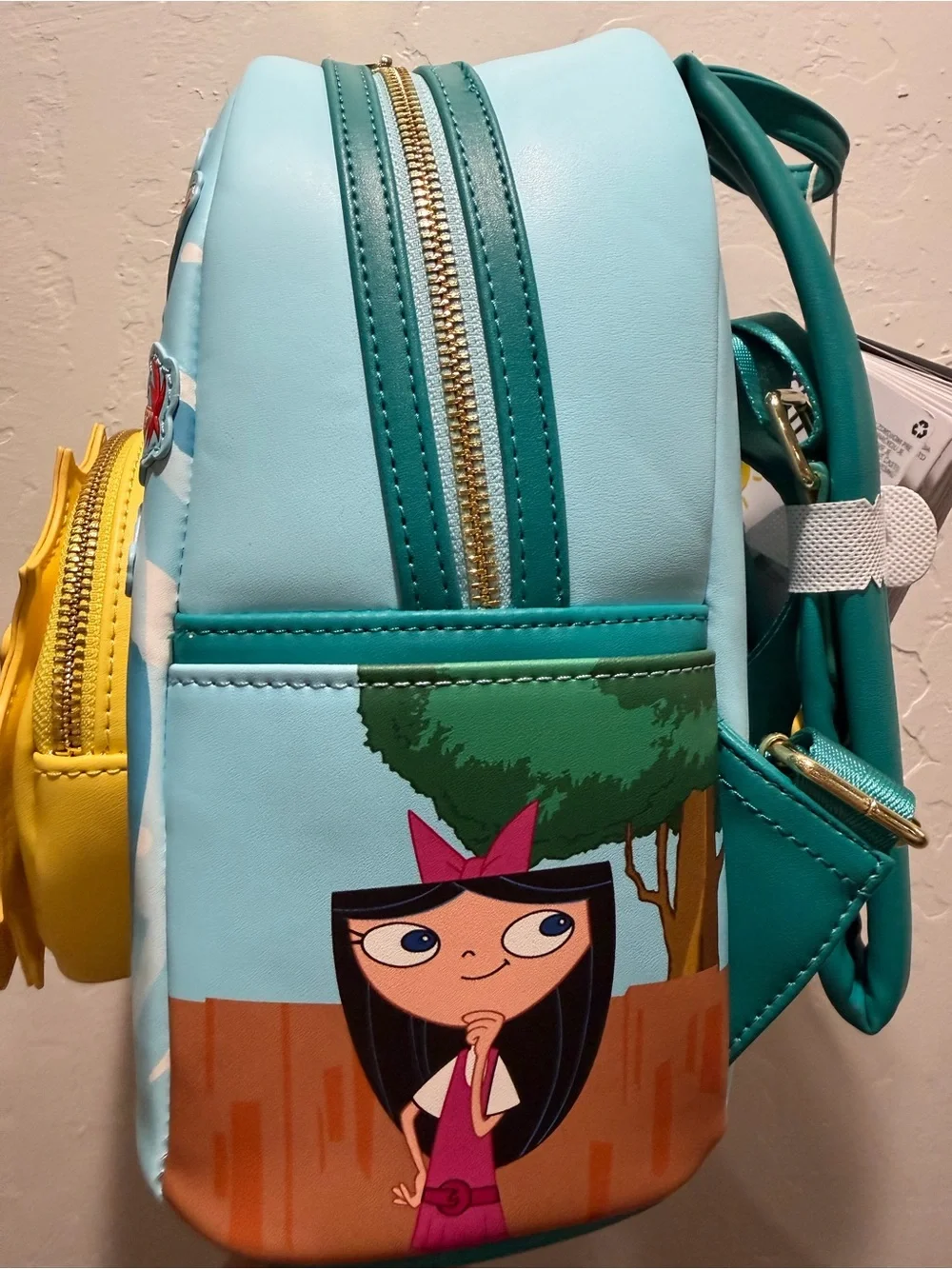 Loungefly Blue Perry the Platypus Kids Mini Backpack with Yellow Sunburst Pocket